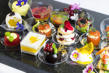 Obraz na płótnie Canvas Canape desserts and snack in plastic cups 
