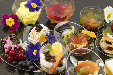 Canape desserts and snack in plastic cups 
