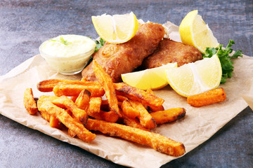 traditional British fish and chips on brown paper