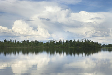 Minnesota lake with trees and dramatic clouds