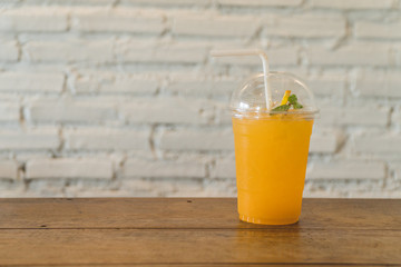 orange juice on wood table