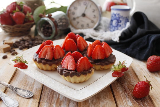 Cheese tartlets with chocolate and sweet strawberry dessert 