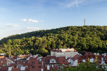 View of old buildings at the Mala Strana District (Lesser Town) and Petrin Lookout Tower at the...