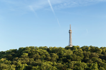 Obraz premium View of the Petrin Lookout Tower at the Petrin Hill in Prague, Czech Republic. Copy space.