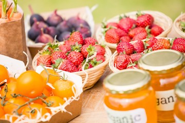 Strawberries and tomatoes on table