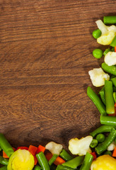 Mixed vegetables on wooden table with copy space. top view