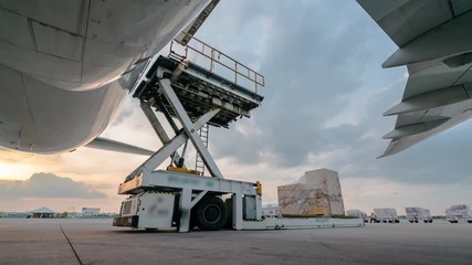 Loading cargo plane outside air freight logistic - Powered by Adobe