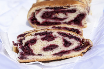 homemade strudel with poppy seeds and cherries