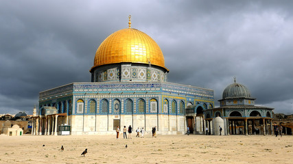Naklejka premium Clouds over Dome of the Rock in Jerusalem over the Temple Mount. Golden Dome is the most known mosque and landmark in Jerusalem and sacred place for all muslims.