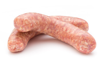 Raw sausage with parsley leaf isolated on white background.