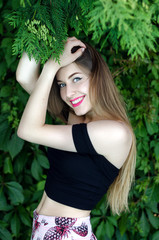 Outdoor portrait of young attractive lady in trendy summer clothes