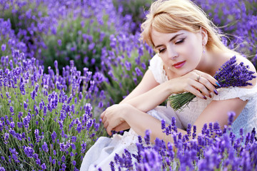 woman sitting at lavender field