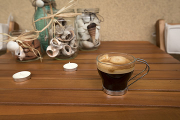 Handmade marine decorations from recycled glass containers, shells, sea stones. Recreation area of the terrace.