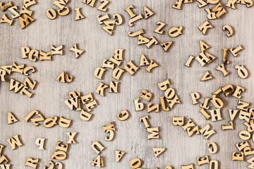 Wooden letters on the table, alphabet, space for text