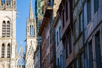Rouen Cathedral and houses at sunny day, France.