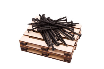 screws on wood toy pallet isolated on white - symbol of transportation, logistic concept