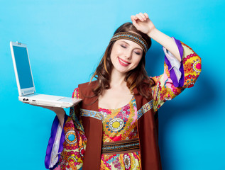 Portrait of Young hippie girl with laptop computer