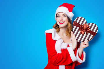 Santa Claus girl in red clothes with gift box