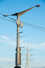 A lamppost against a clear blue sky