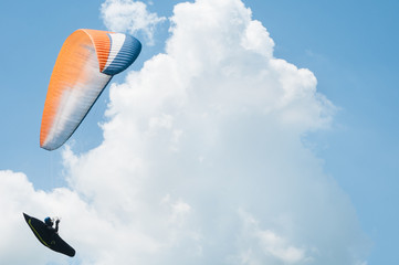 Paraglider flies paraglider in the sky. Paragliding.
