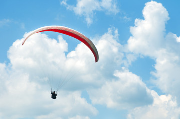 Paraglider flies paraglider in the sky. Paragliding.