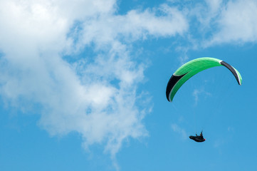 Paraglider flies paraglider in the sky. Paragliding.