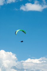 Paraglider flies paraglider in the sky. Paragliding.