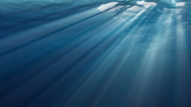 High quality Looping animation of ocean waves from realistic underwater. Light rays shining through. Computer graphic 3d rendering
