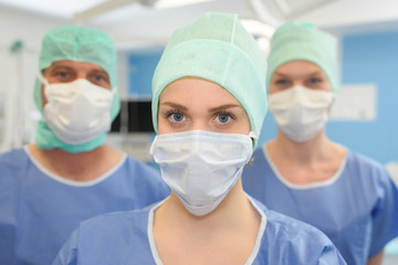 surgeons wearing protective mask and cup ready for operation