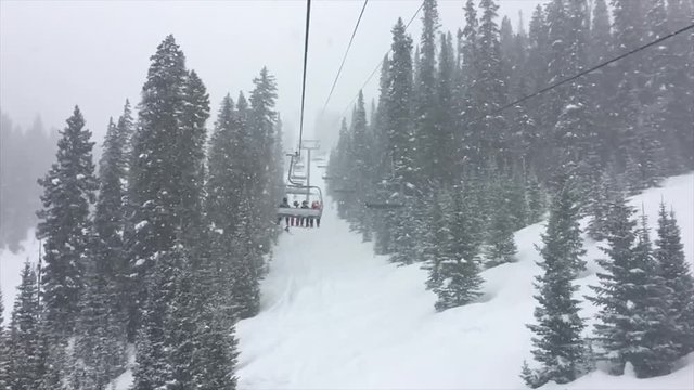 Heavy snow falls in slow motion during blizzard at Telluride Ski Resort in Colorado