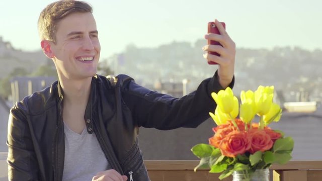 Fashionable Man Takes A Selfe On A Rooftop In The City