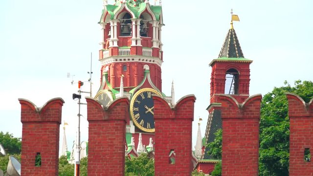 The Moscow Kremlin wall and famous Spasskaya tower clock telephoto lens dolly shot