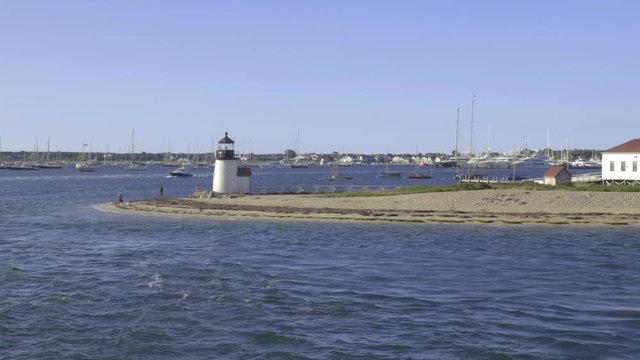 View Of Brant Point Lighthouse, On Nantucket Island, As Boat Moves Away