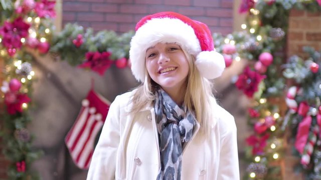 Cute Teenage Girl Poses For Christmas Portraits In Mall 