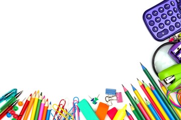 Fototapeta premium Colorful school supplies corner border against a white background