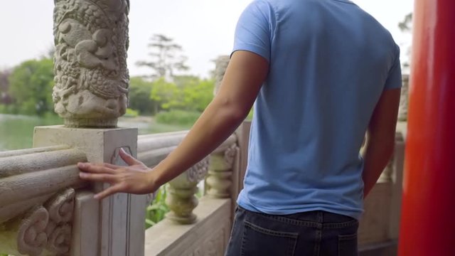 Tourist Explores Pagoda, Touches Stone Work, Slow Motion