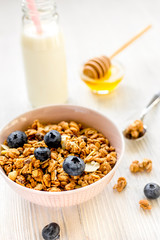 Healthy morning with granola breakfast on white kitchen table