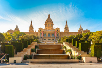Naklejka premium Spain square or Placa De Espanya during morning golden hour, with the National Museum, in Barcelona, Spain