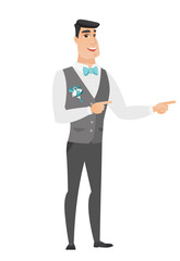 Young caucasian groom pointing to the side.