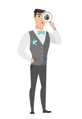 Caucasian groom with magnifying glass.