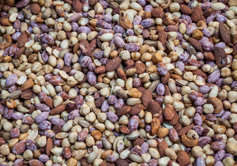 Background nuts, walnut, pistachios, peanuts, hazelnut, Indian nut, on a bunch, healthy food