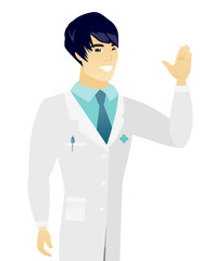 Young asian doctor waving his hand.
