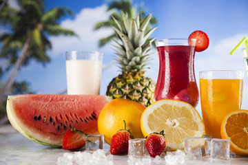 Fresh tropical fruits, Summer drink and palm branch