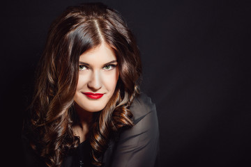 Fototapeta premium Portrait of a woman with red lipstick