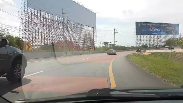 Driving down highway through the suberb in the evening time lapse