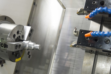 CNC lathe machine (Turning machine) cutting the metal  screw thread part .Hi-precision CNC machining concept.