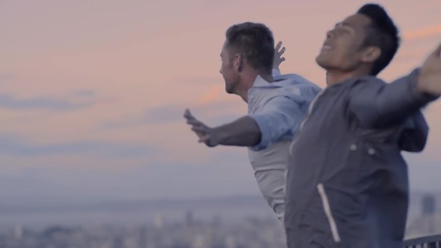 Fun Couple Spread Their Arms And Feel The Breeze, At Scenic Overlook, Above San Francisco