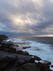 Fototapeta na wymiar Cloudy view at Maroubra rock cliff