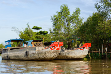 Fototapeta premium Wooden cargo boat on the Mekong River Delta