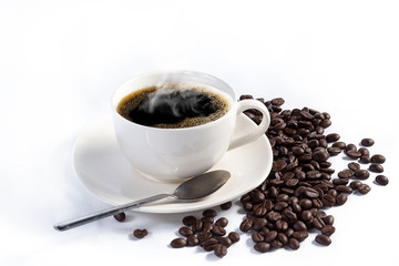 Hand pours instant coffee from a spoon in a coffee cup